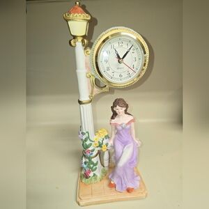 Elegant Purple Figurine Clock with Floral Accents